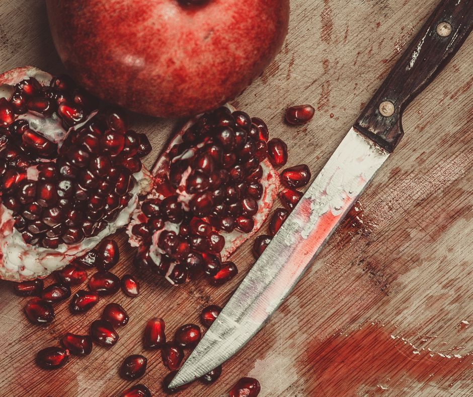 pomegranate on cutting board