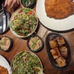 table full of pork dishes